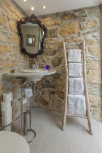 A bed or beds in a room at Iliopetra House