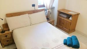 A bed or beds in a room at Le JOLI COIN DU PASSAGE