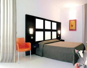 Postel nebo postele na pokoji v ubytování Hotel Admeto
