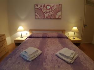 Postel nebo postele na pokoji v ubytování App4rent Saturno 4 - family apartment, wifi, parking