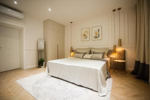 Tempat tidur dalam kamar di Club boutique rooms