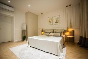 Tempat tidur dalam kamar di Club boutique rooms