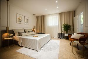 Tempat tidur dalam kamar di Club boutique rooms