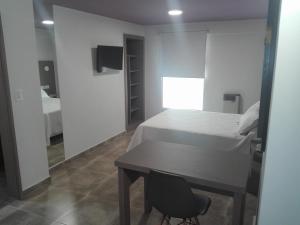 Et tv og/eller underholdning på Hotel Americano Pergamino