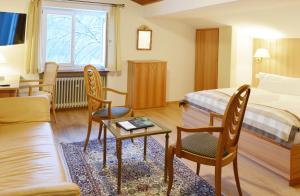 Postel nebo postele na pokoji v ubytování Stoll's Hotel Alpina