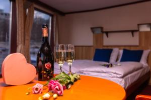 A bed or beds in a room at Fortuna Boat Hotel Budapest