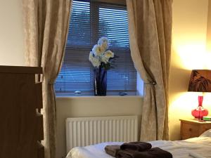 A bed or beds in a room at Abodes B&B 