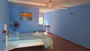 Postel nebo postele na pokoji v ubytování Binucot Beach Resort + 21 fotografií