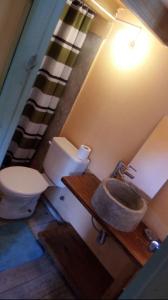 a bathroom with a toilet and a sink at Resiliencia in Punta del Este