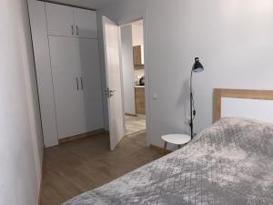 Postel nebo postele na pokoji v ubytování Сozy 2 Room apart NEW GUDAURI, LOFT 2, apt 252