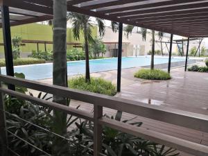 a view from the balcony of a resort with a swimming pool at Centrio Tower Beside Ayala Studio Unit with Balcony 23 in Cagayan de Oro