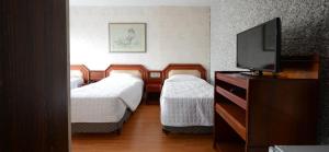 Postel nebo postele na pokoji v ubytování Caravelle Palace Hotel + 37 fotografií