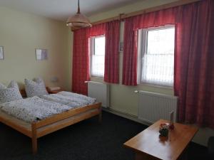 Postel nebo postele na pokoji v ubytování Penzion Tina