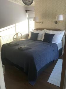 Postel nebo postele na pokoji v ubytování Villa Kertelhof Guesthouse