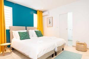 Voodi või voodid majutusasutuse Villas Rock & Beach toas