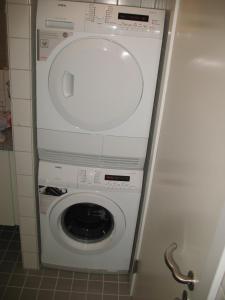 a washer and dryer in a small room at Esben Juhls Guest Room in Copenhagen +15 photos