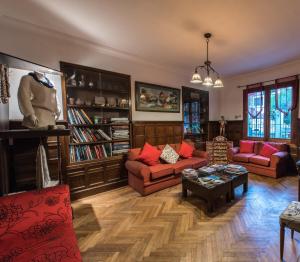 a living room with two couches and a table at Hotel Boutique Villa Elisa in Arequipa