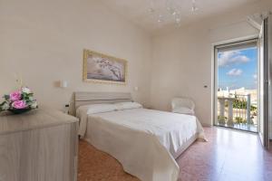 سرير أو أسرّة في غرفة في San Pancrazio Suite Apartment by BarbarHouse