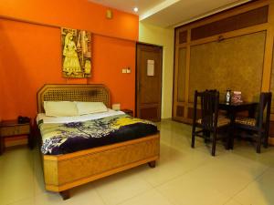 Hotel Ashlesh Manipal客房内的一张或多张床位