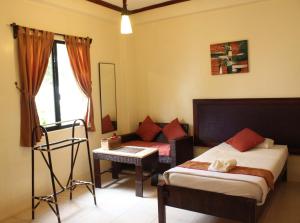 Cama o camas de una habitación en Palms Cove Resort