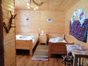 Postel nebo postele na pokoji v ubytování Cabana Ghetari