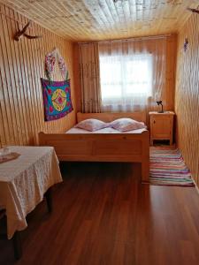 Postel nebo postele na pokoji v ubytování Cabana Ghetari