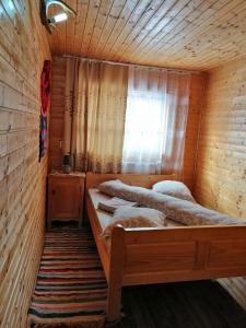Postel nebo postele na pokoji v ubytování Cabana Ghetari