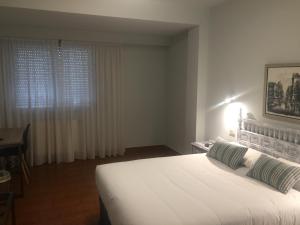 Posteľ alebo postele v izbe v ubytovaní Hotel Celanova