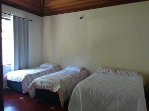 Katil atau katil-katil dalam bilik di Chácara do Delei