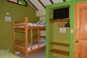 Postel nebo postele na pokoji v ubytování Hotel Cabañas San Cayetano