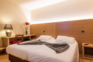 Postel nebo postele na pokoji v ubytování Hotel Firenze