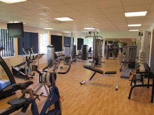 a gym with several treadmills and cardio machines at Stöde Camping in Edsta