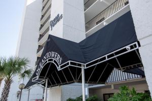a blue awning on the side of a building at Ocean Towers Resort in Myrtle Beach