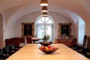 a room with a table with a bowl of fruit on it at Altstadthotel Bad Griesbach in Bad Griesbach