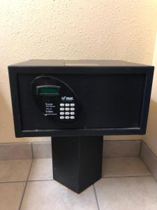 a microwave oven sitting on top of a wall at SureStay Hotel by Best Western Clermont Theme Park West in Kissimmee