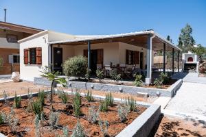 a house with a garden in front of it at Levanda Home in Stavros