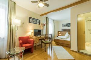 Postel nebo postele na pokoji v ubytování Hotel Brunner