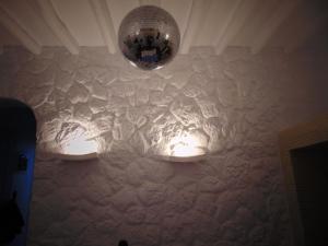 a chandelier hanging from a wall in a room at AMO Folegandros in Karavostasi