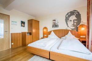 Postel nebo postele na pokoji v ubytování Hotel Brunner