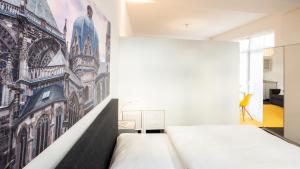 Säng eller sängar i ett rum på Relax Aachener Boardinghouse Phase 2