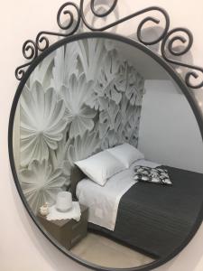 A bed or beds in a room at PEPPE'S HOME Luxury and relax apartament