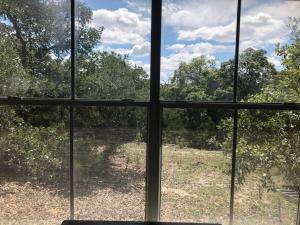 an open window with a view of a field at Perfect Country-Side Get-Away in Boerne