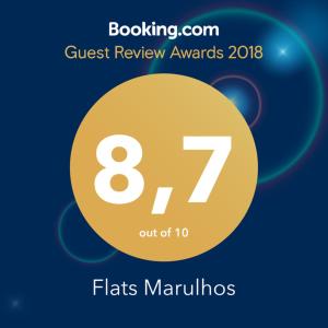 um círculo amarelo com o número nele em Flats Marulhos Resort by BMS em Porto de Galinhas