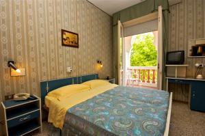Postel nebo postele na pokoji v ubytování Hotel Victory