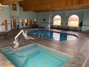 a pool in a large room with a swimming pool at Parkfield Inn - Clinton in Clinton