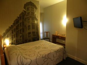 Cama o camas de una habitación en Hotel Photo Zabalburu