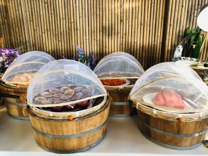 a group of five baskets filled with different types of food at Phi Phi CoCo Beach Resort in Phi Phi Islands