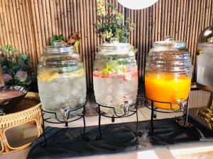 three glass containers filled with different types of drinks at Phi Phi CoCo Beach Resort in Phi Phi Islands