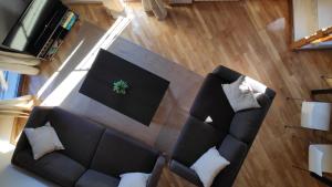 Posezení v ubytování Apartamentos GO - Tordesillas House + 8 fotografií