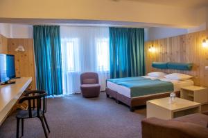 Postel nebo postele na pokoji v ubytování Complex Hotelier COTA O MIE